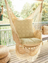 Byron white hanging chair styled on a deck