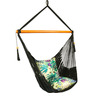 Angle view of black hammock chair styled with outdoor cushions.