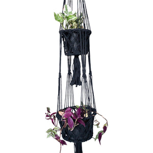 Detail view of double macrame plant hangers styled with plants