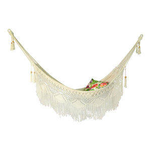 Byron white hammock hanging styled with two outdoor cushions
