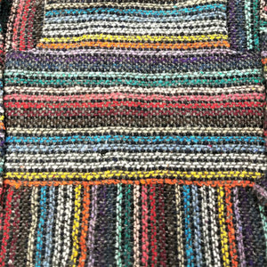Closeup of the fabric of the grey stripe kids baja hoodie.