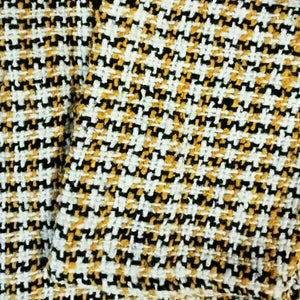 Closeup of the mustard yellow baja hoodie fabric
