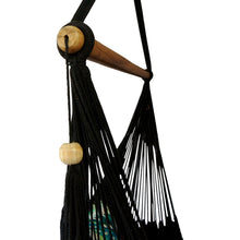 Closeup of side view of black hammock chair