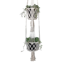 Detail view of double white macrame pot holder holding Silver Falls plant