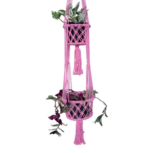 Double pink macrame plant hangers styled with two hanging plants