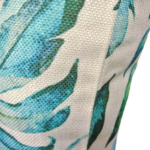 Side view of aqua palm print outdoor cushion covers
