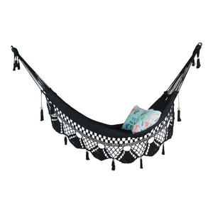 ondi black hammock with tassels styled with cushions