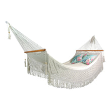 Luxury macrame hammock styled with outdoor cushions