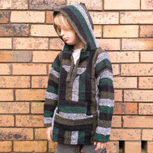 Boy model wearing green and black kids baja hoodie