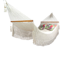 Luxury boho macrame hammock styled with outdoor cushions