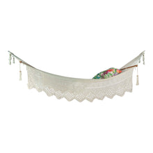Full view of the whitehaven white hammock styled with cushions