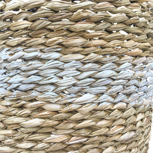 Detail view of hand woven seagrass planter basket with lining